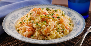 Brazilian Main Dishes Delicious Arroz com Camarão, a flavorful rice and shrimp dish seasoned with various spices.