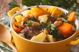 Hearty Cozido, a flavorful stew made with a variety of meats and vegetables. Brazilian Main Dishes