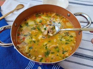 Hearty Mocotó soup, a flavorful dish made with cow's feet, beans, and vegetables. 