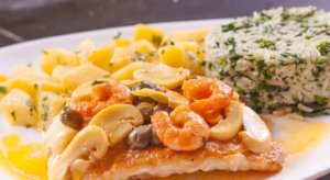 Succulent Peixe à Belle Meunière, a delightful fish dish accompanied by a creamy sauce made from butter and lemon.